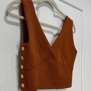 This top is Maeve by anthropology pecan button side button down tank top